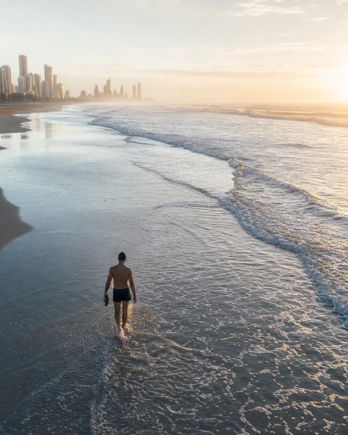 An early-morning swimmer on Surfers Paradise beach
